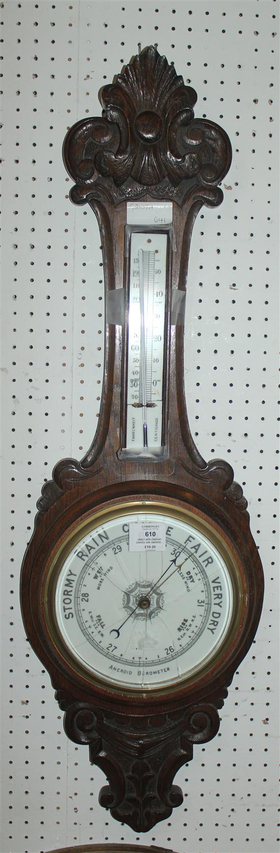 Early 20th Century carved oak aneroid wheel barometer with faults A/F(-)